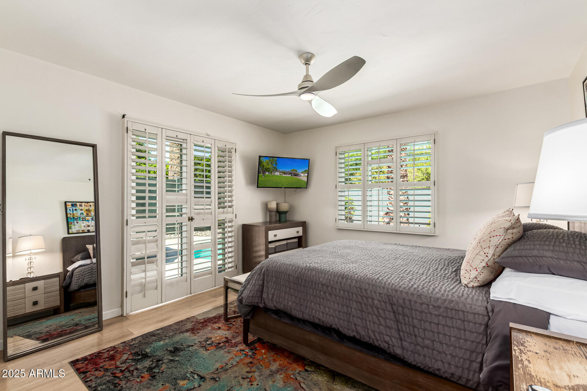3809 North 35th Street Phoenix, AZ 85018 - Photo 31 of 43 a bed sitting in a bedroom next to a window