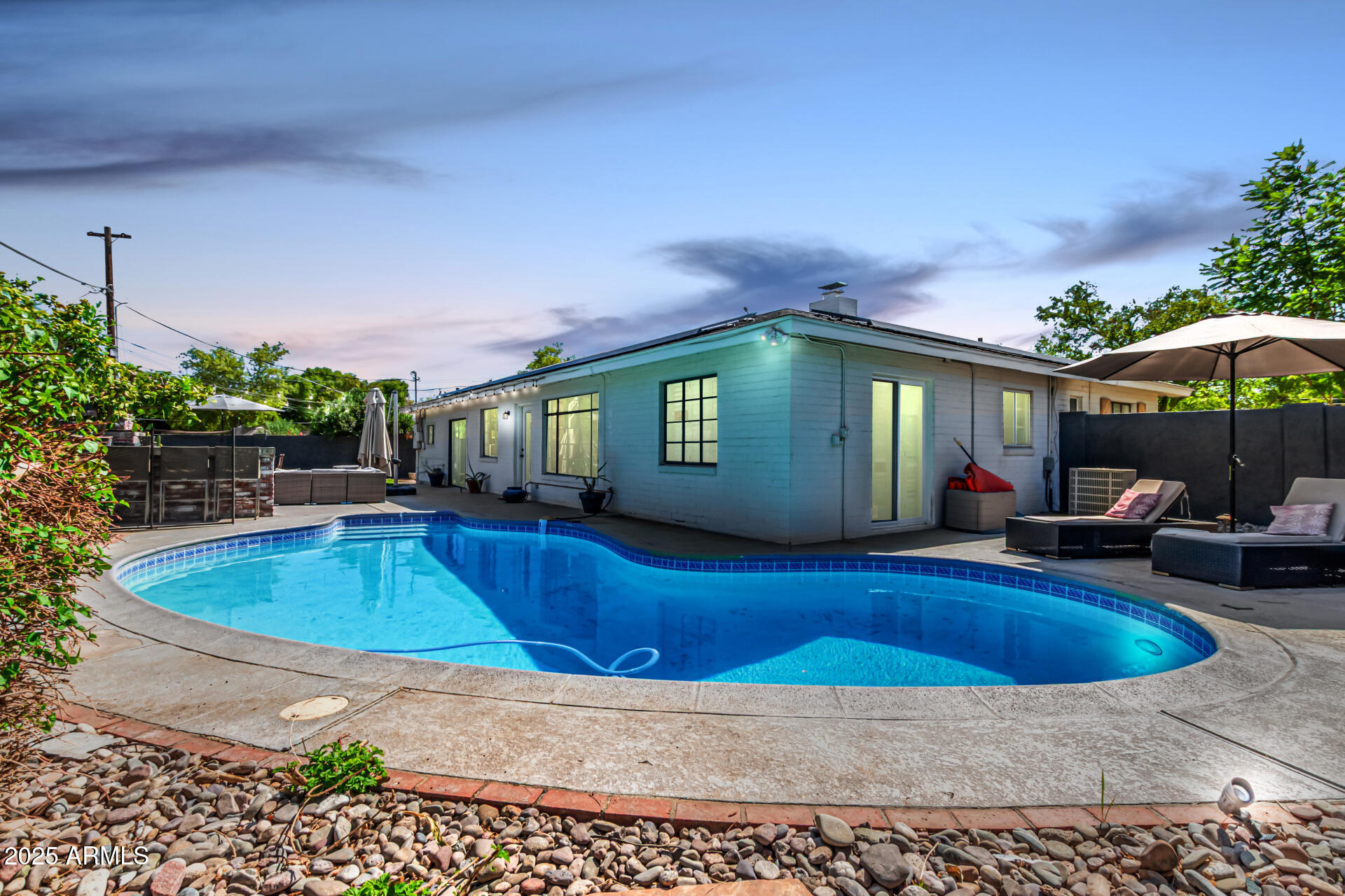 3809 North 35th Street Phoenix, AZ 85018 - Photo 41 of 43 a view of a house with swimming pool and sitting area