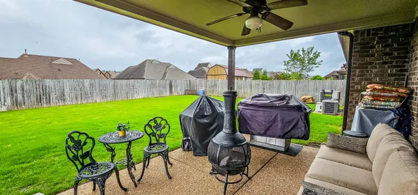 a view of yard with patio