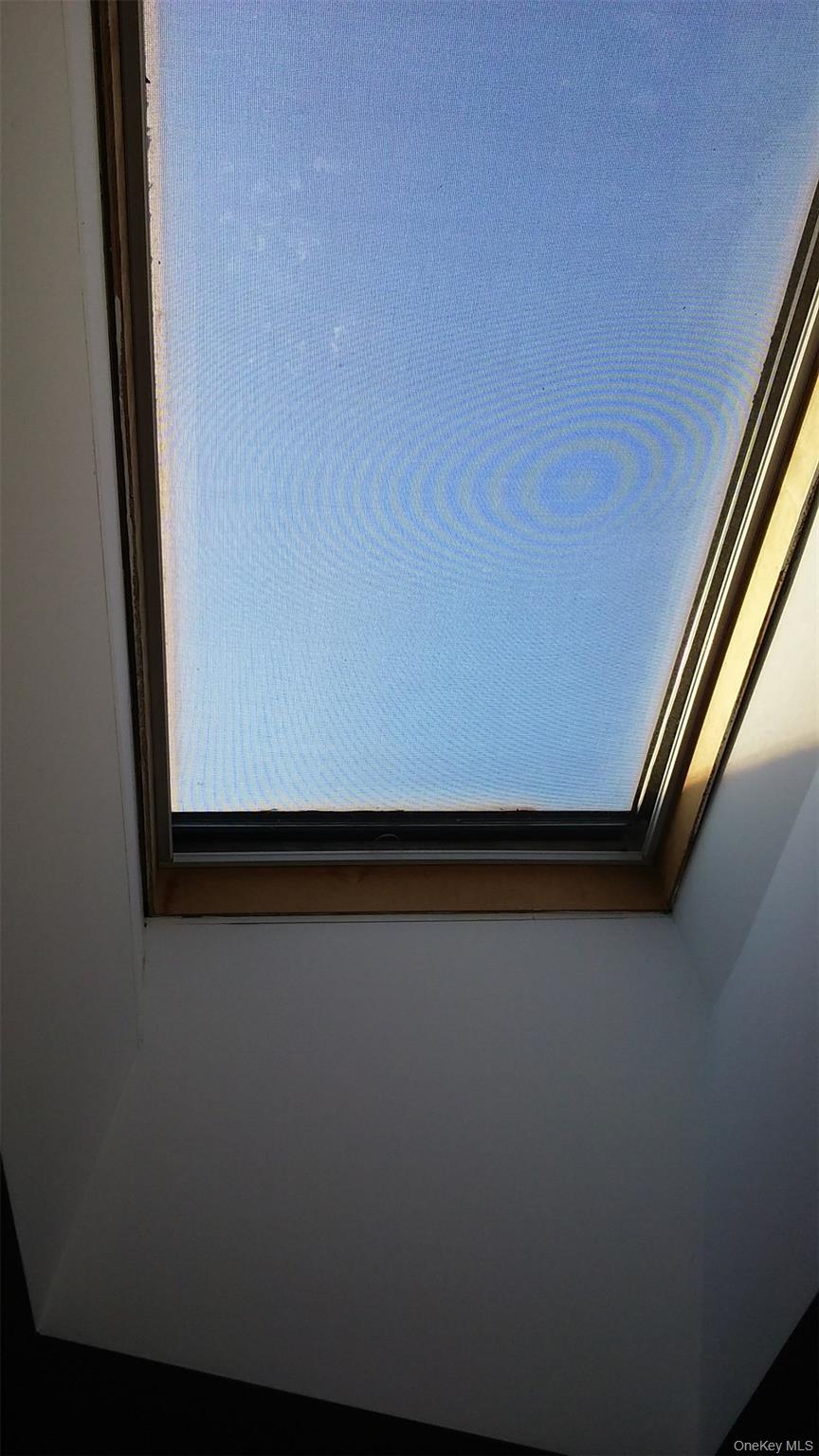 97-56 105th Street, Unit 2 Queens, NY 11416 - Photo 27 of 29 a view of a room with wooden floor