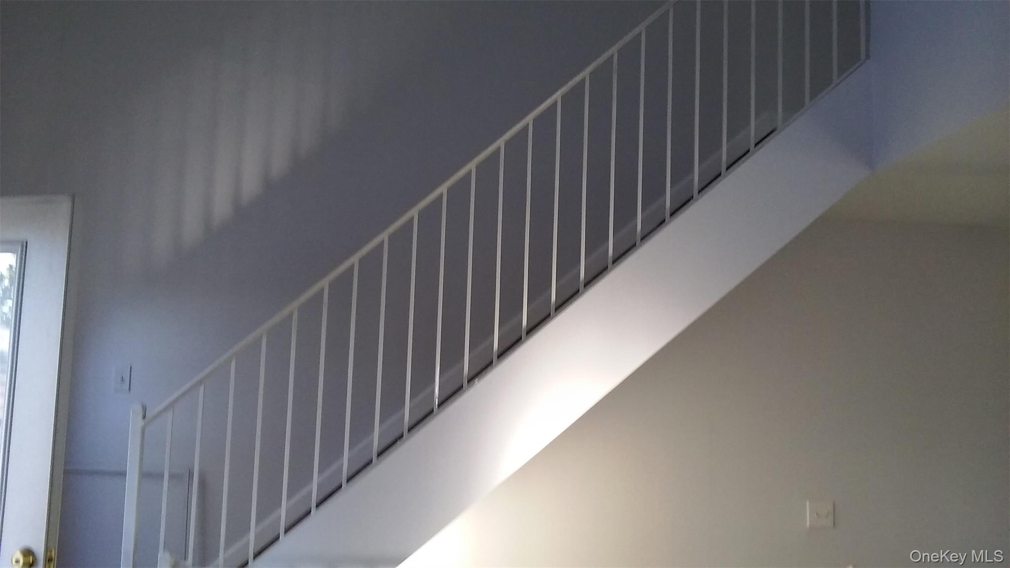 97-56 105th Street, Unit 2 Queens, NY 11416 - Photo 29 of 29 a view of balcony with wooden floor