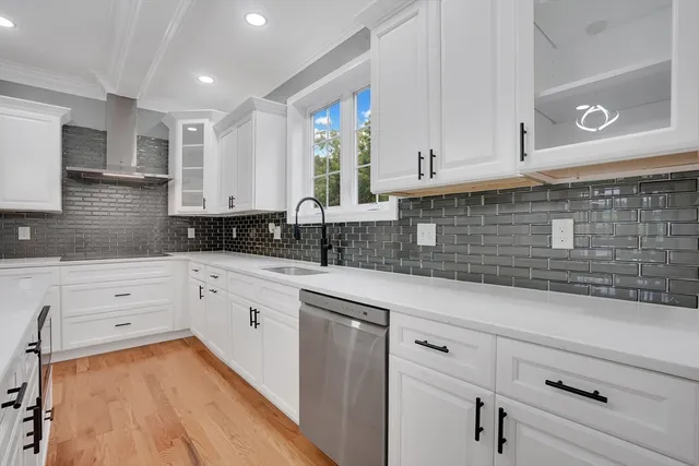 a view of an entryway with wooden floor
