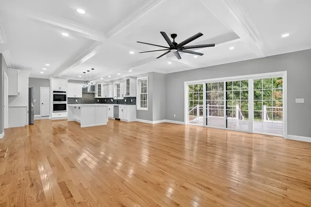a view of a kitchen with a sink and microwave
