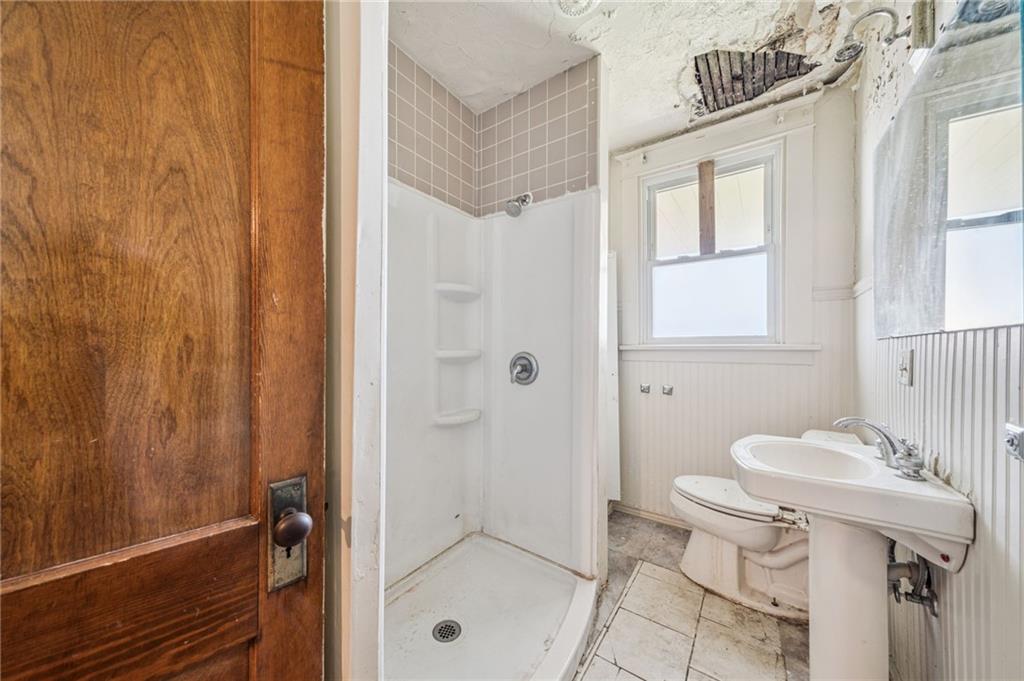 338 Catherine Street McKees Rocks, PA 15136 - Photo 11 of 25 a bathroom with a sink a toilet and shower