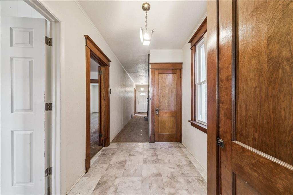 338 Catherine Street McKees Rocks, PA 15136 - Photo 12 of 25 a view of a hallway with wooden floor and staircase