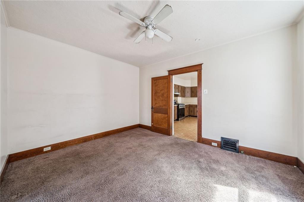 338 Catherine Street McKees Rocks, PA 15136 - Photo 18 of 25 an empty room with closet and a ceiling fan