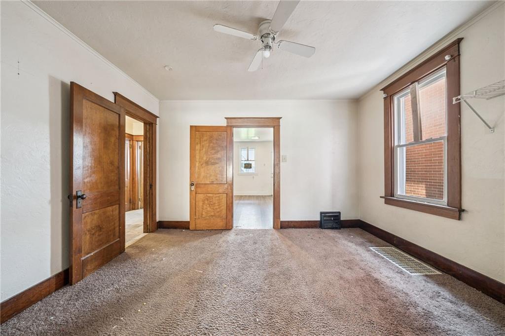 338 Catherine Street McKees Rocks, PA 15136 - Photo 7 of 25 a view of empty room with windows and chandelier fan