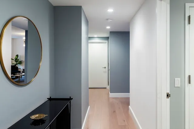 a view of a hallway with front door