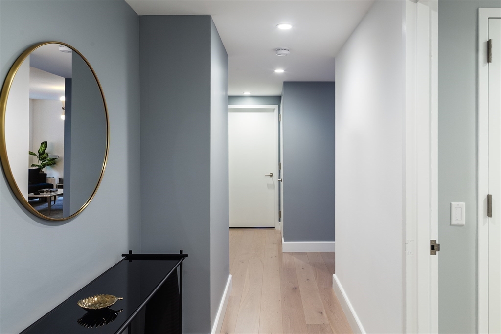 100 Lovejoy Wharf, Unit 6B Boston, MA 02114 - Photo 3 of 25 a view of a hallway with front door