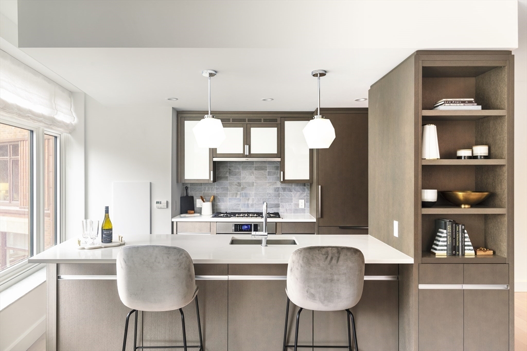 100 Lovejoy Wharf, Unit 6B Boston, MA 02114 - Photo 6 of 25 a kitchen with a cabinets and window