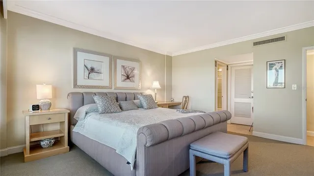 a bedroom with a bed and a lamp