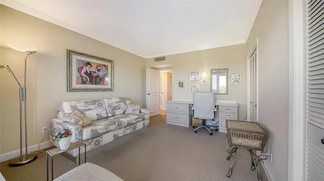 a living room with furniture and a chair