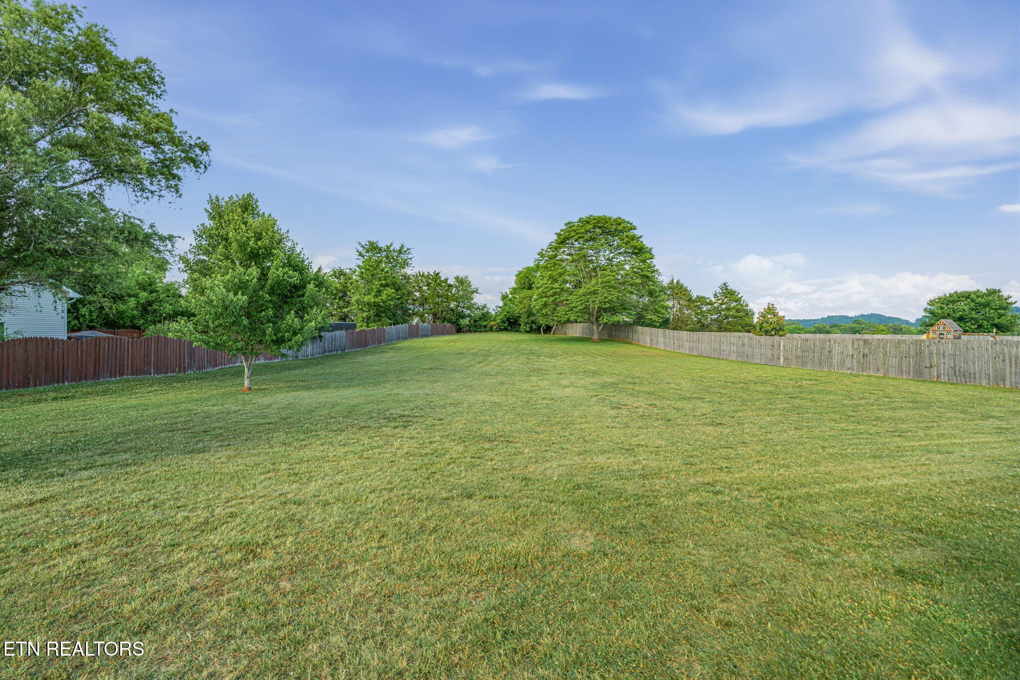 7030 Westerly Winds Road Knoxville, TN 37931 - Photo 37 of 40 a view of a field with a tree in it