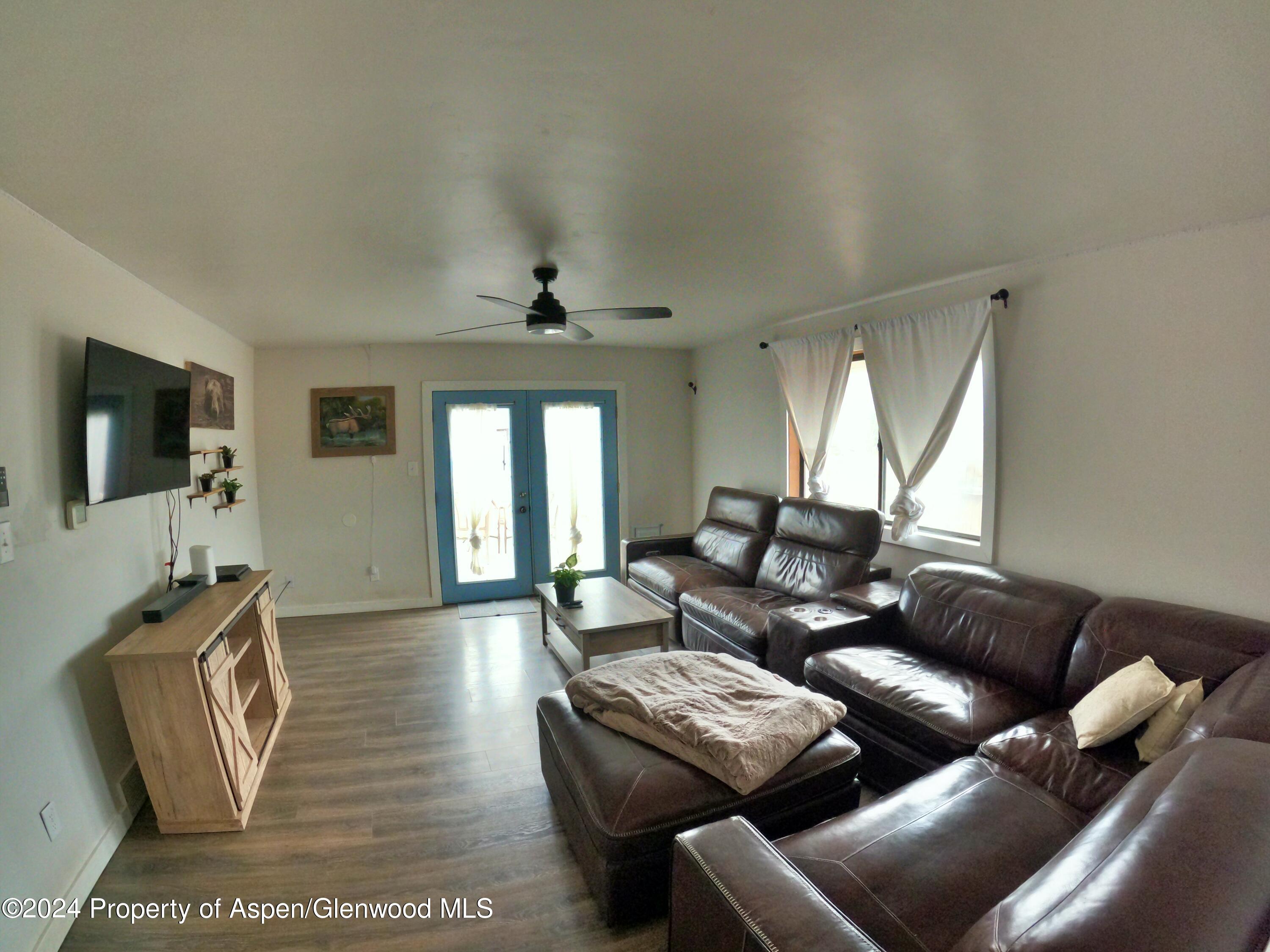 429 East 7th Street Rifle, CO 81650 - Photo 6 of 17 a living room with furniture and a flat screen tv