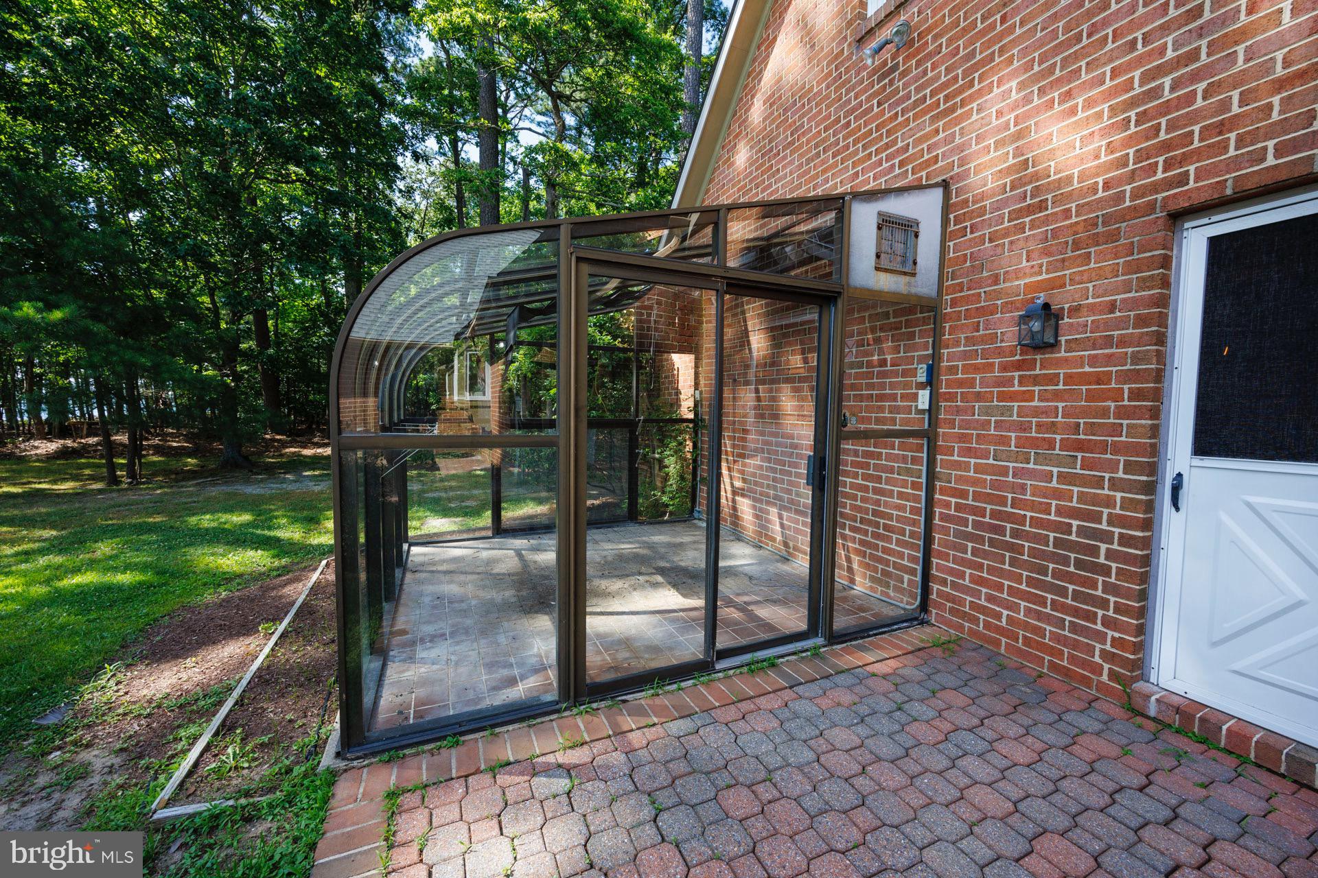 24190 Deep Neck Road Royal Oak, MD 21662 - Photo 45 of 48 greenhouse off patio and garage