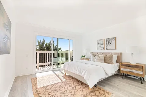 a bedroom with a bed and a table