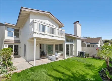 a front view of a house with a yard table and chairs
