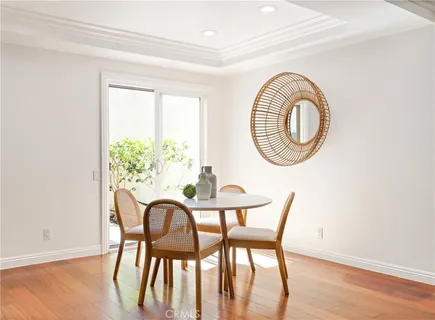 a view of a dining room with furniture and a window