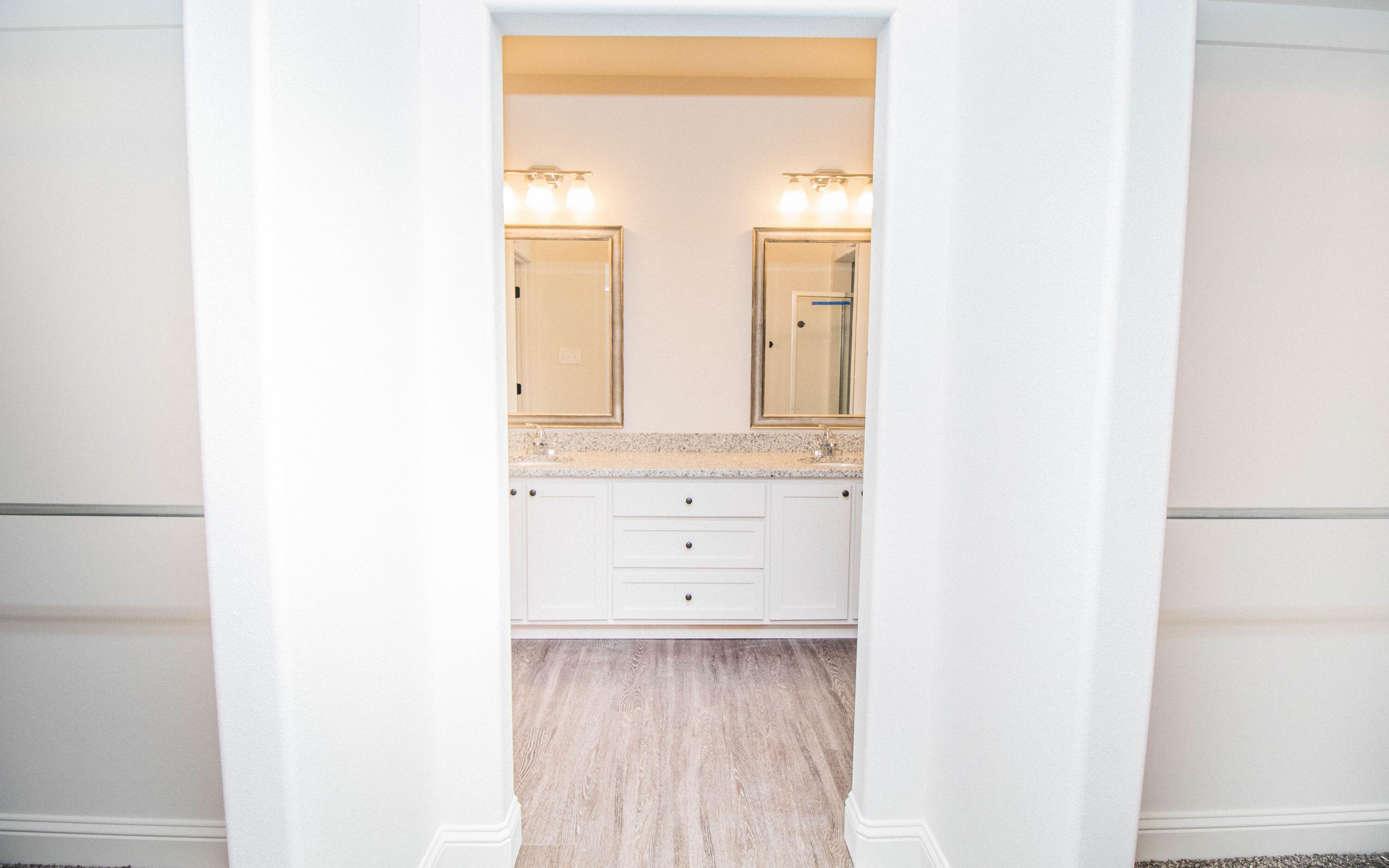 1613 102nd Street Lubbock, TX 79423 - Photo 11 of 18 a view of a bathroom with mirror