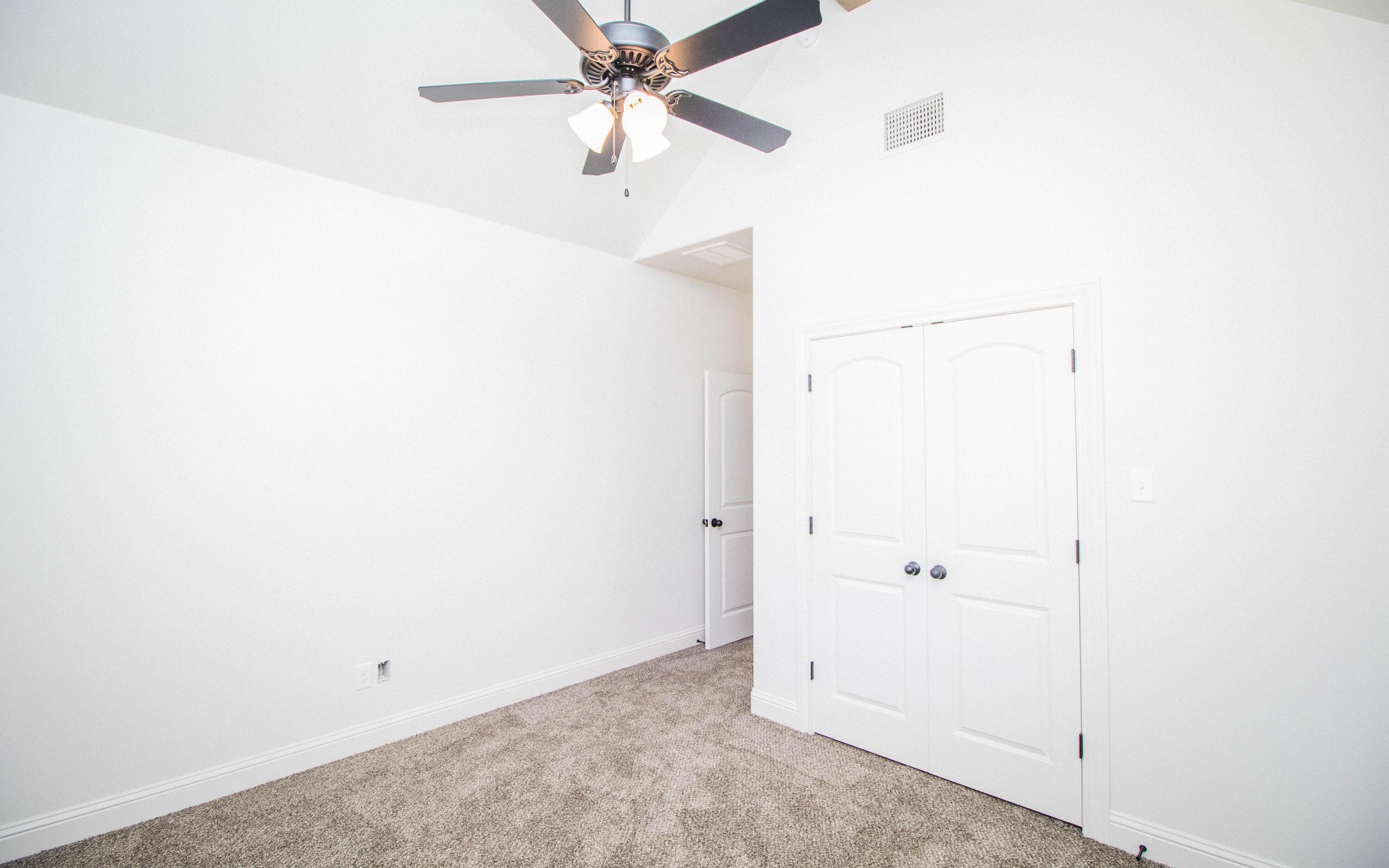1613 102nd Street Lubbock, TX 79423 - Photo 13 of 18 an empty room with fan