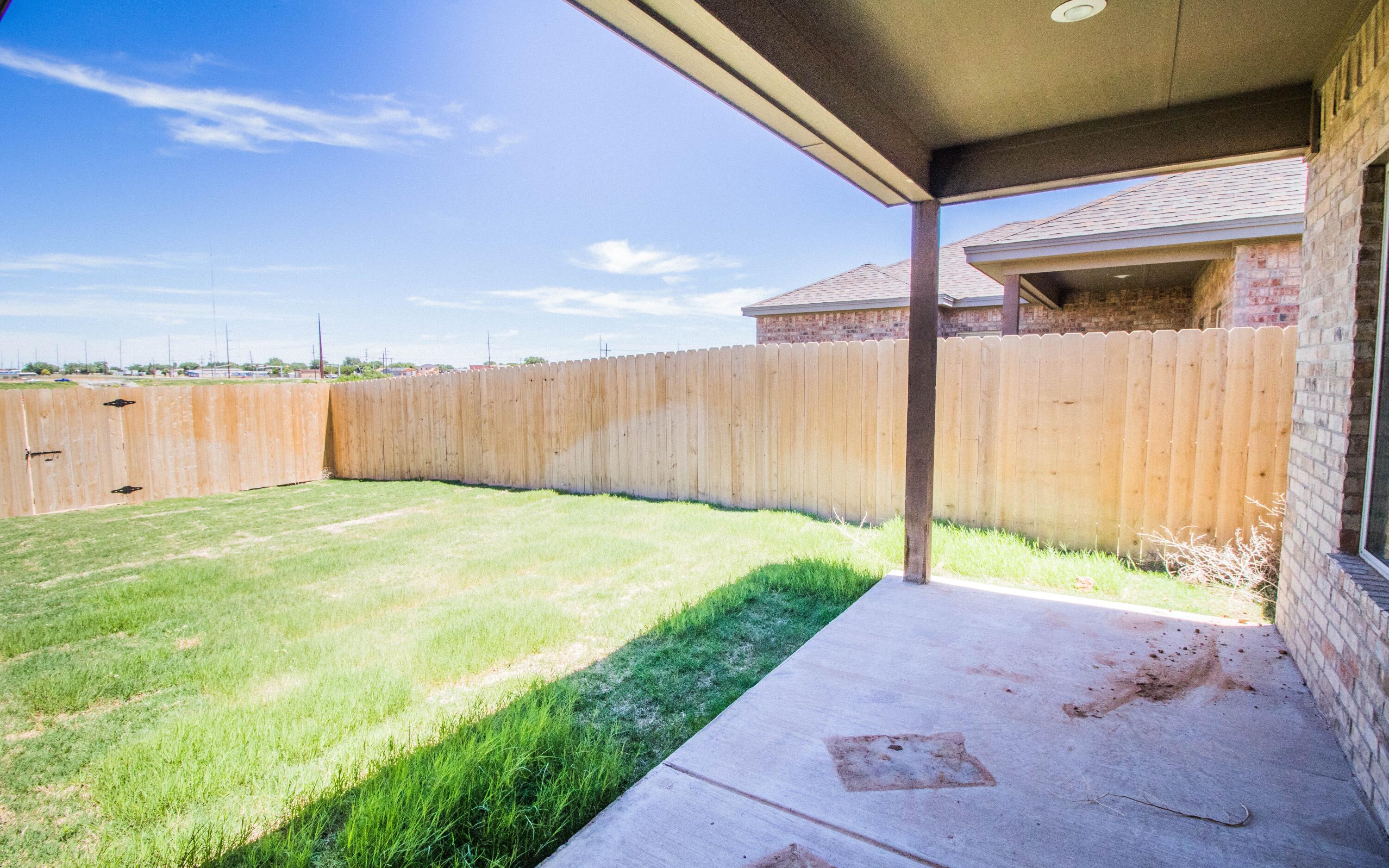1613 102nd Street Lubbock, TX 79423 - Photo 7 of 18 a bathroom with a tub and shower