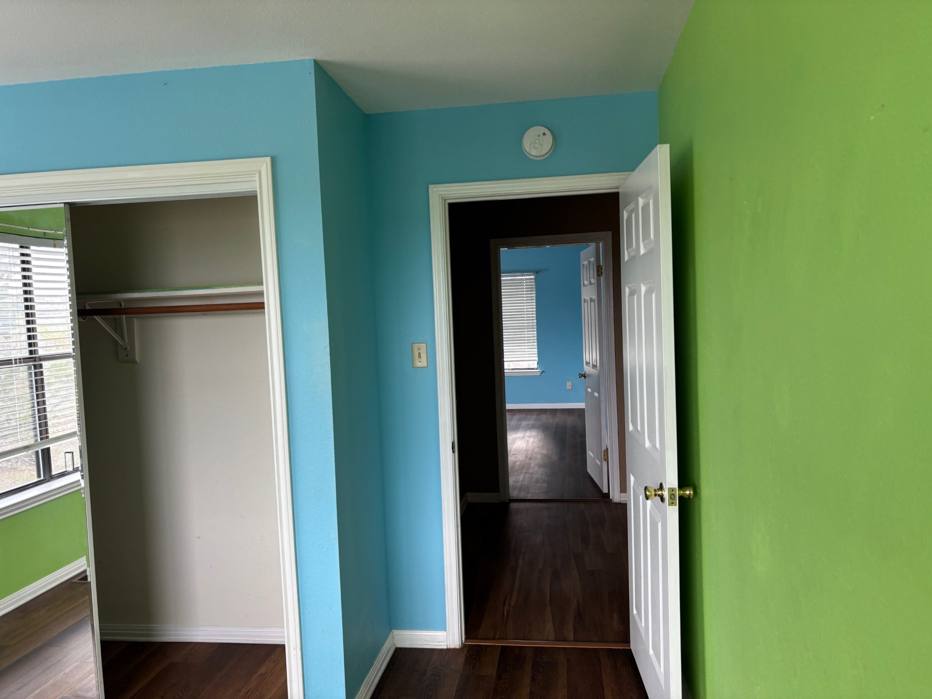 15401 Lariat Trail Austin, TX 78734 - Photo 14 of 23 Unfurnished bedroom featuring dark wood-style flooring and a closet