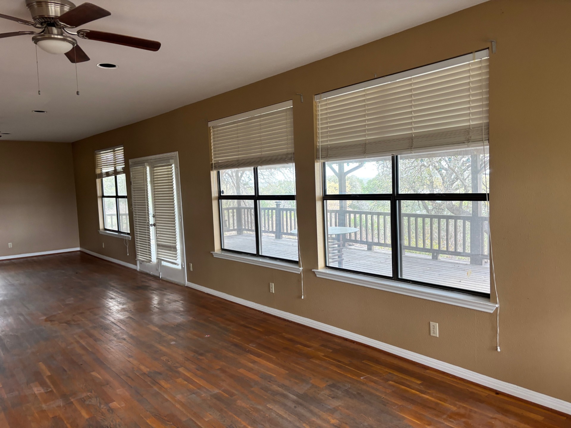 15401 Lariat Trail Austin, TX 78734 - Photo 17 of 23 Unfurnished room with ceiling fan and dark wood-type flooring