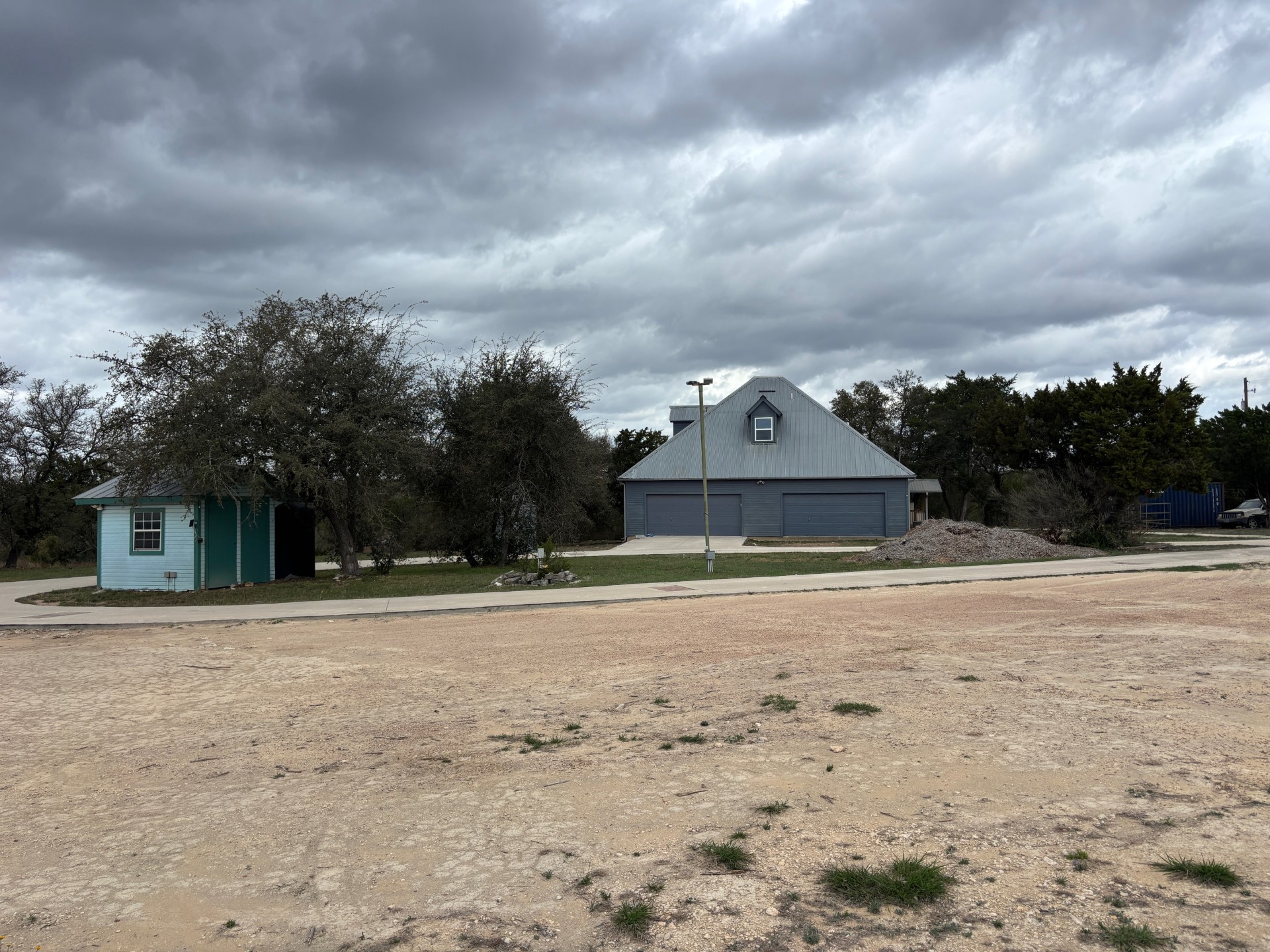 15401 Lariat Trail Austin, TX 78734 - Photo 18 of 23 View of yard featuring an outdoor structure and a detached garage