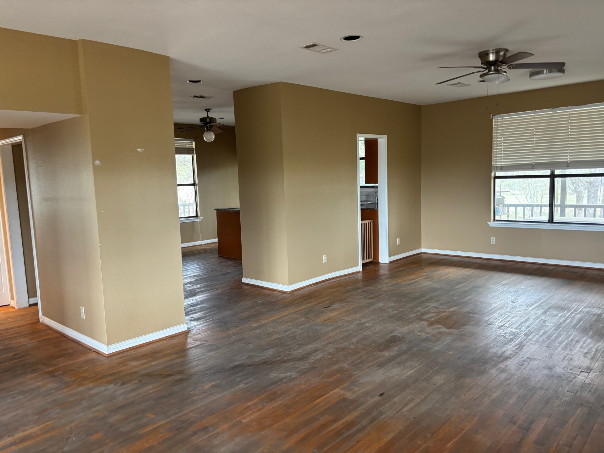 15401 Lariat Trail Austin, TX 78734 - Photo 21 of 23 Empty room with ceiling fan and dark wood finished floors