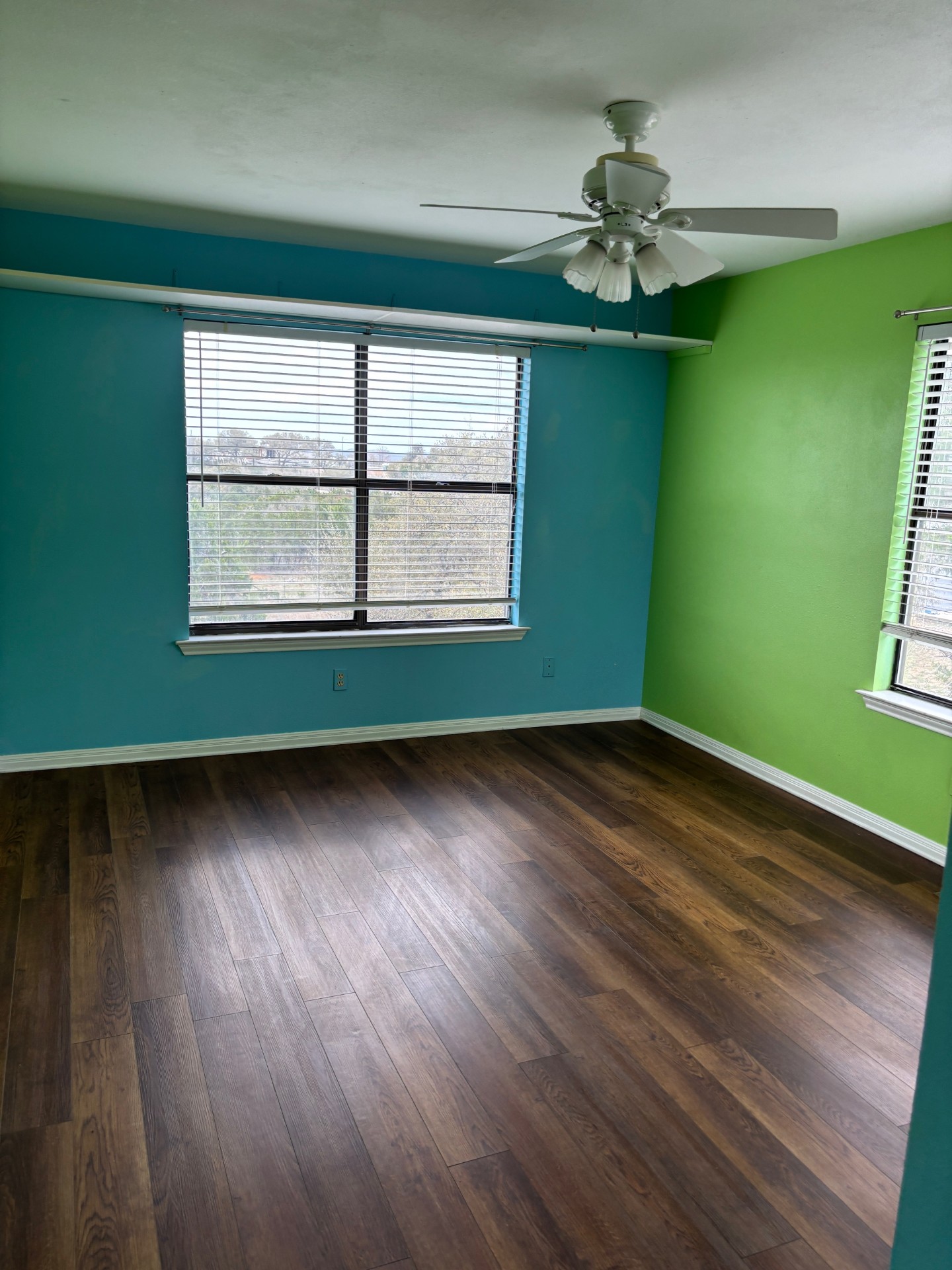 15401 Lariat Trail Austin, TX 78734 - Photo 5 of 23 Spare room featuring dark wood-style floors and a ceiling fan