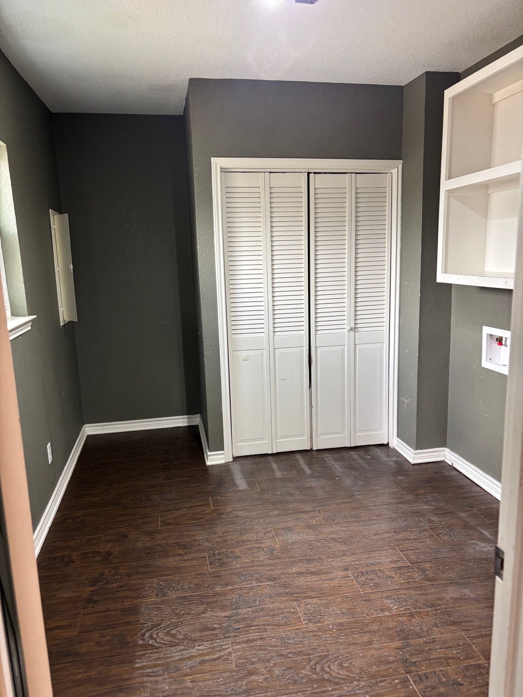 15401 Lariat Trail Austin, TX 78734 - Photo 6 of 23 Unfurnished bedroom featuring dark wood-type flooring and a closet