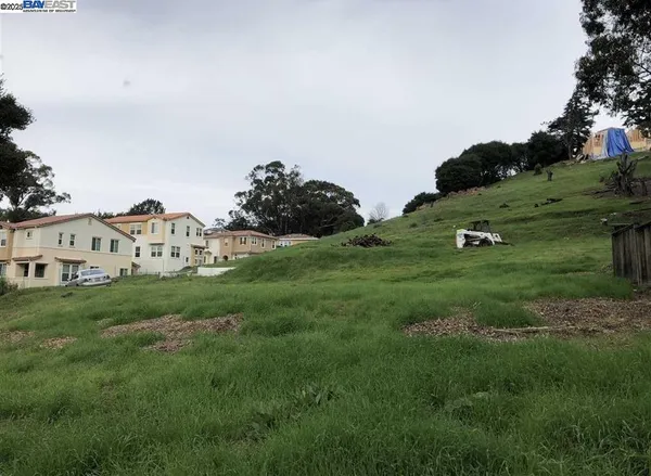 a view of a white house with a yard