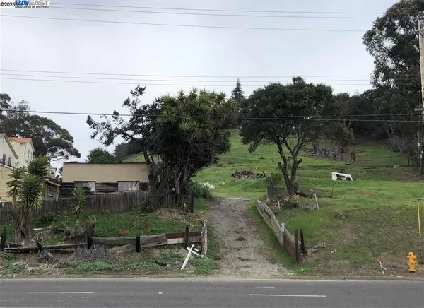 a view of a lake with a yard