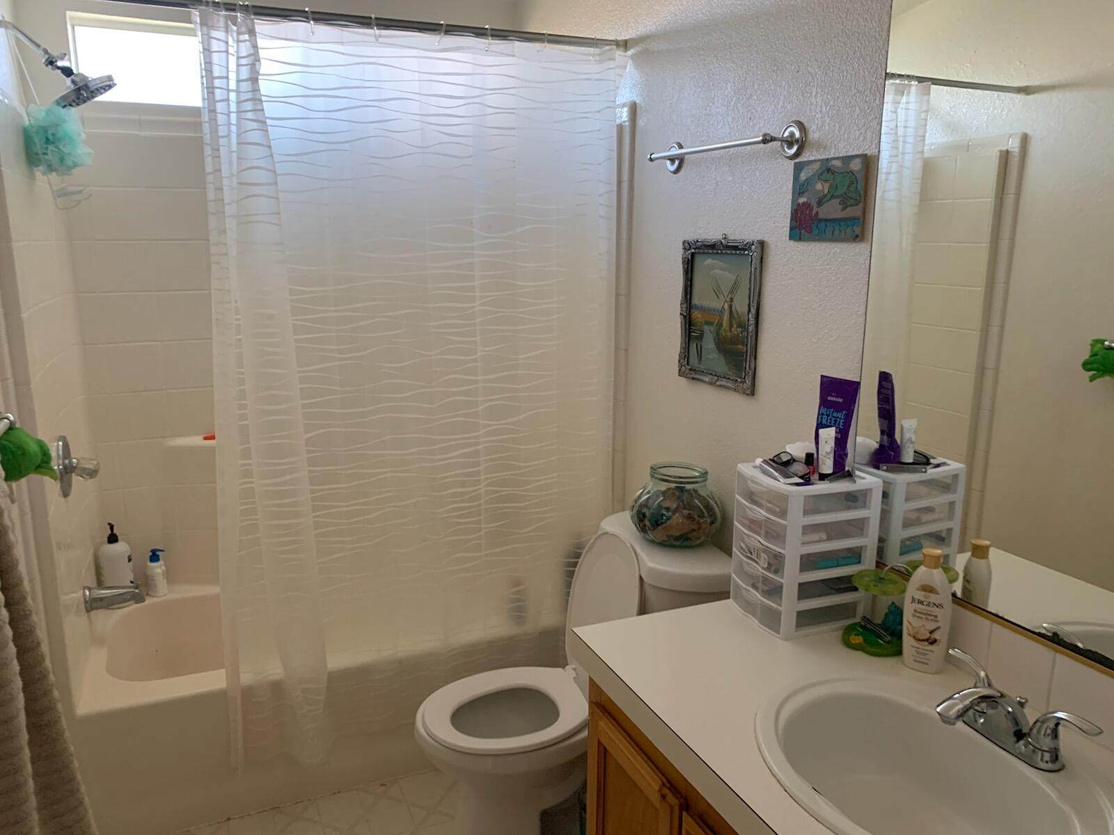 20567 Plymire Road Red Bluff, CA 96080 - Photo 12 of 20 a bathroom with a sink a toilet and shower