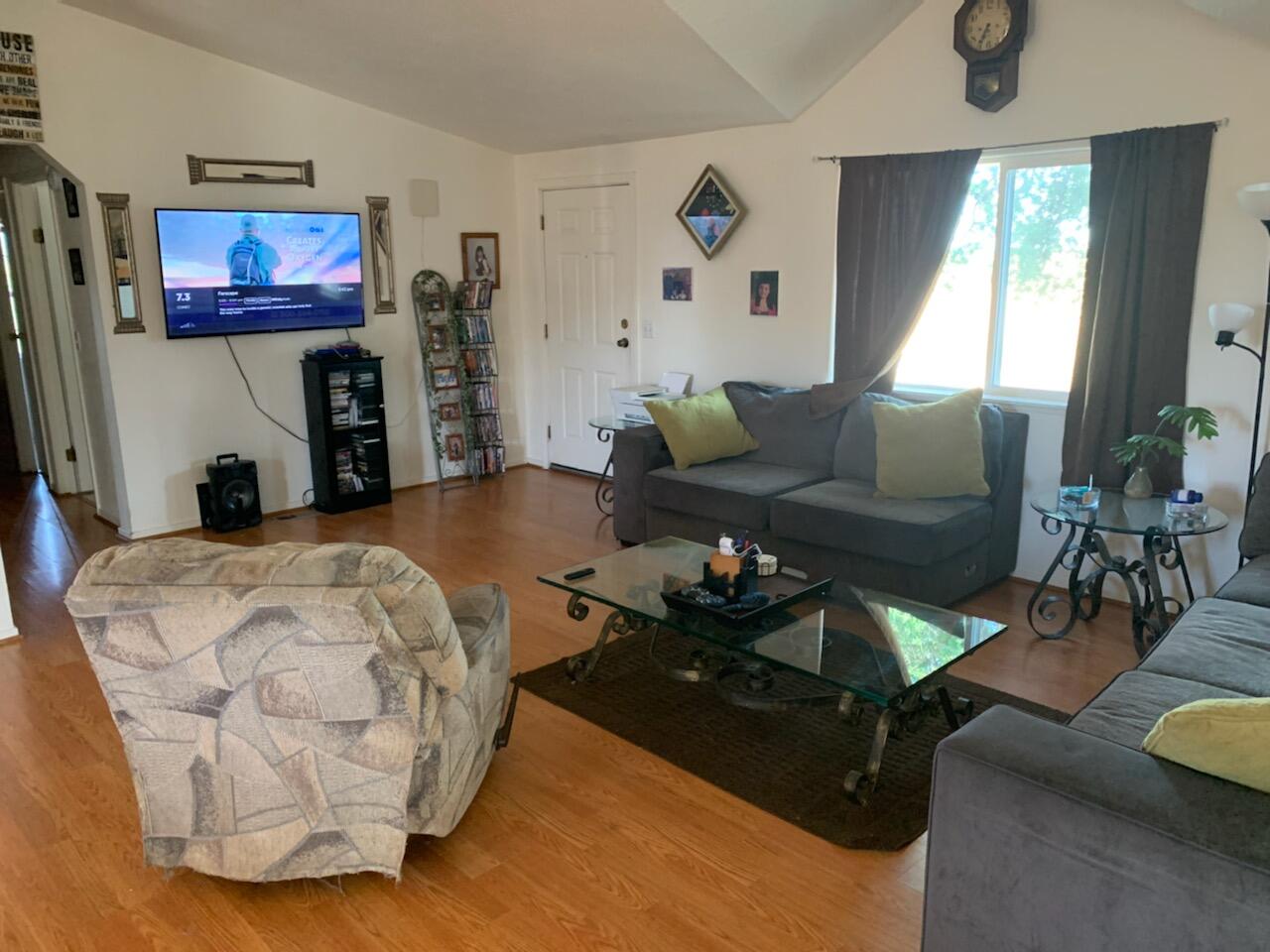20567 Plymire Road Red Bluff, CA 96080 - Photo 4 of 20 a living room with furniture and a flat screen tv
