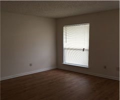 18609 Greenwell Springs Road Greenwell Springs, LA 70739 - Photo 3 of 6 an empty room with a window