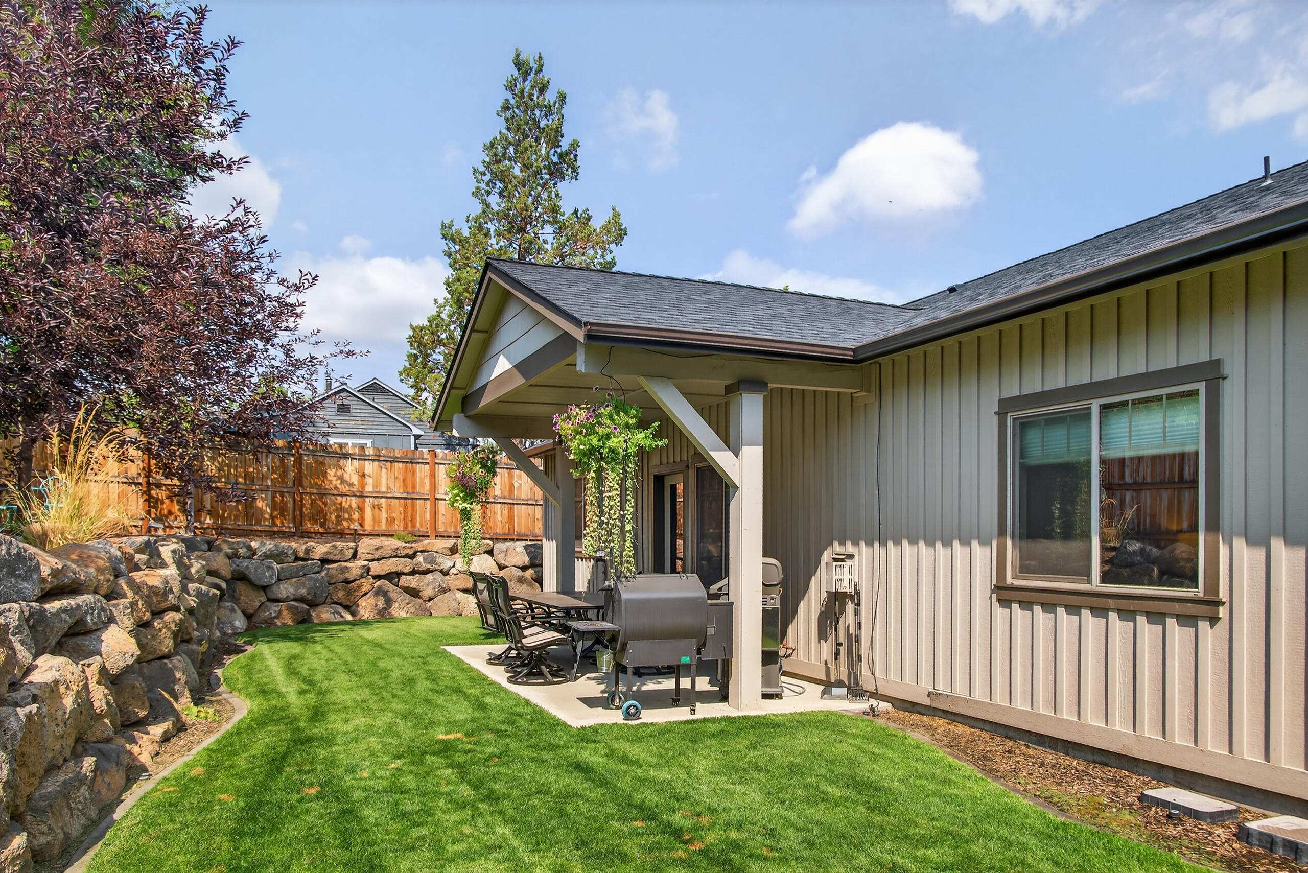 2793 Southwest 33rd Street Redmond, OR 97756 - Photo 32 of 44 a view of a chair and table in backyard of the house