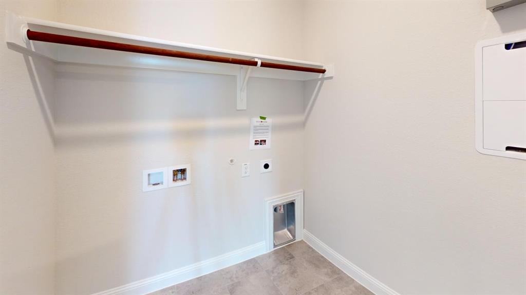 8407 Cornerstone Drive Rowlett, TX 75088 - Photo 3 of 25 Laundry area featuring a hanging rod, integrated shelf, utility hookups, and tiled flooring