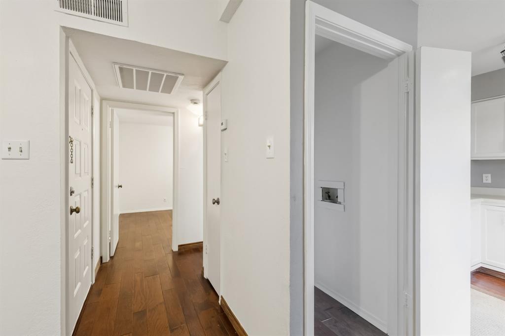 4748 Old Bent Tree Lane, Unit 1808 Dallas, TX 75287 - Photo 15 of 28 a view of a hallway with wooden floor