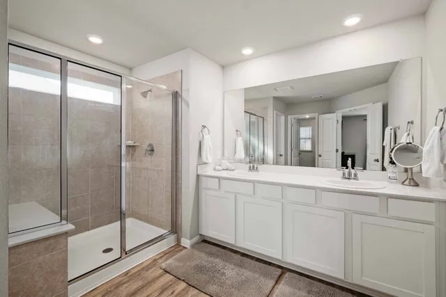 a view of walk in closet with clothes