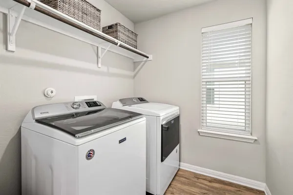 a utility room with dryer and washer