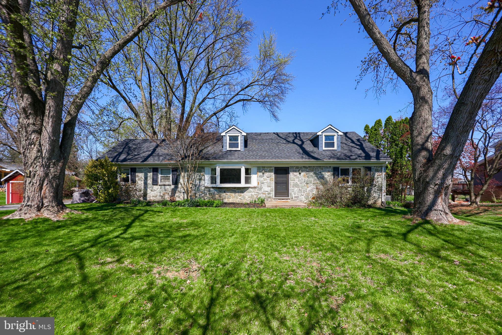 2033 Robindale Avenue Lancaster, PA 17601 - Photo 2 of 47 a view of a big yard next to a house