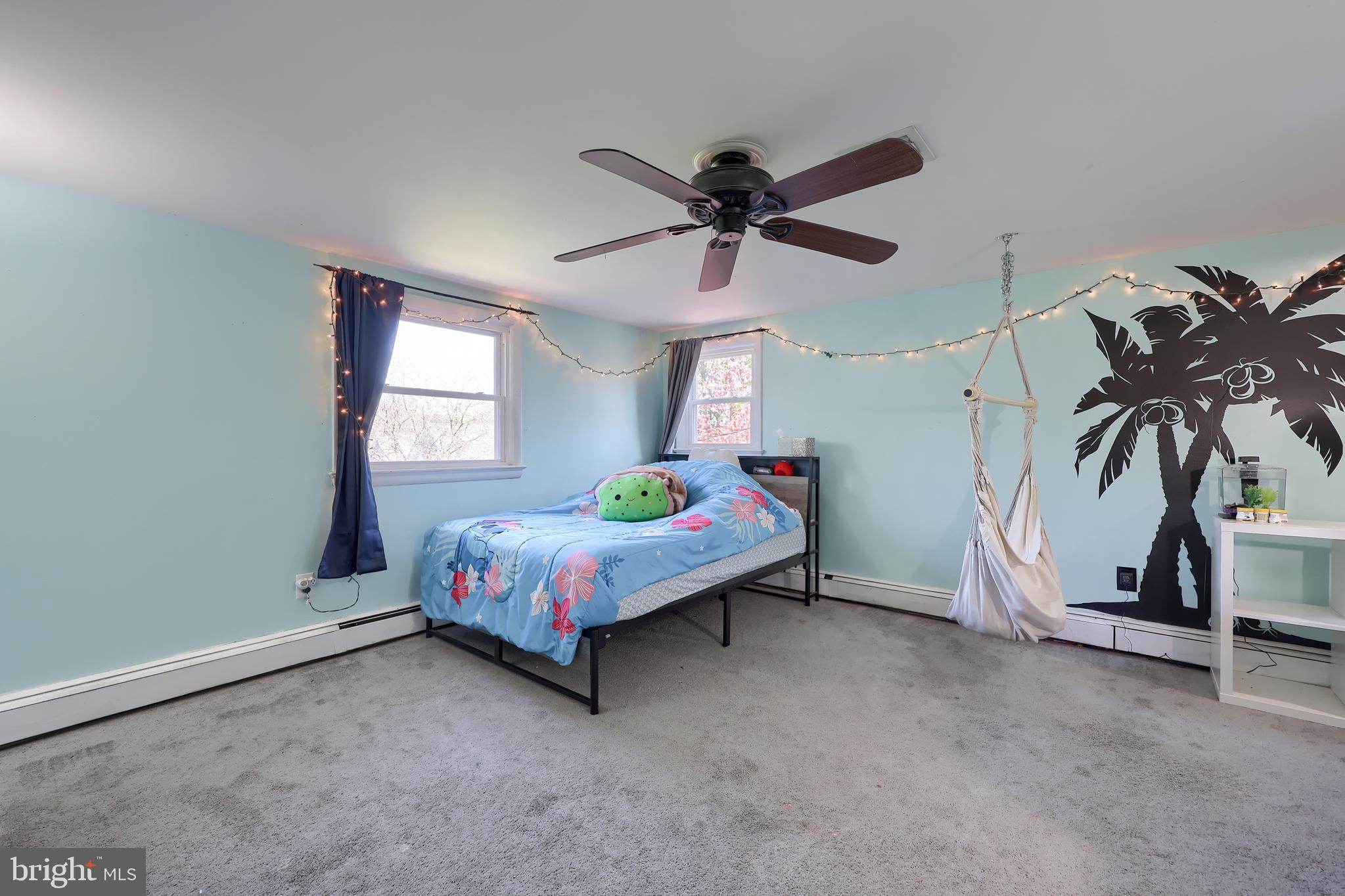 2033 Robindale Avenue Lancaster, PA 17601 - Photo 27 of 47 a spacious bedroom with a bed and a chandelier