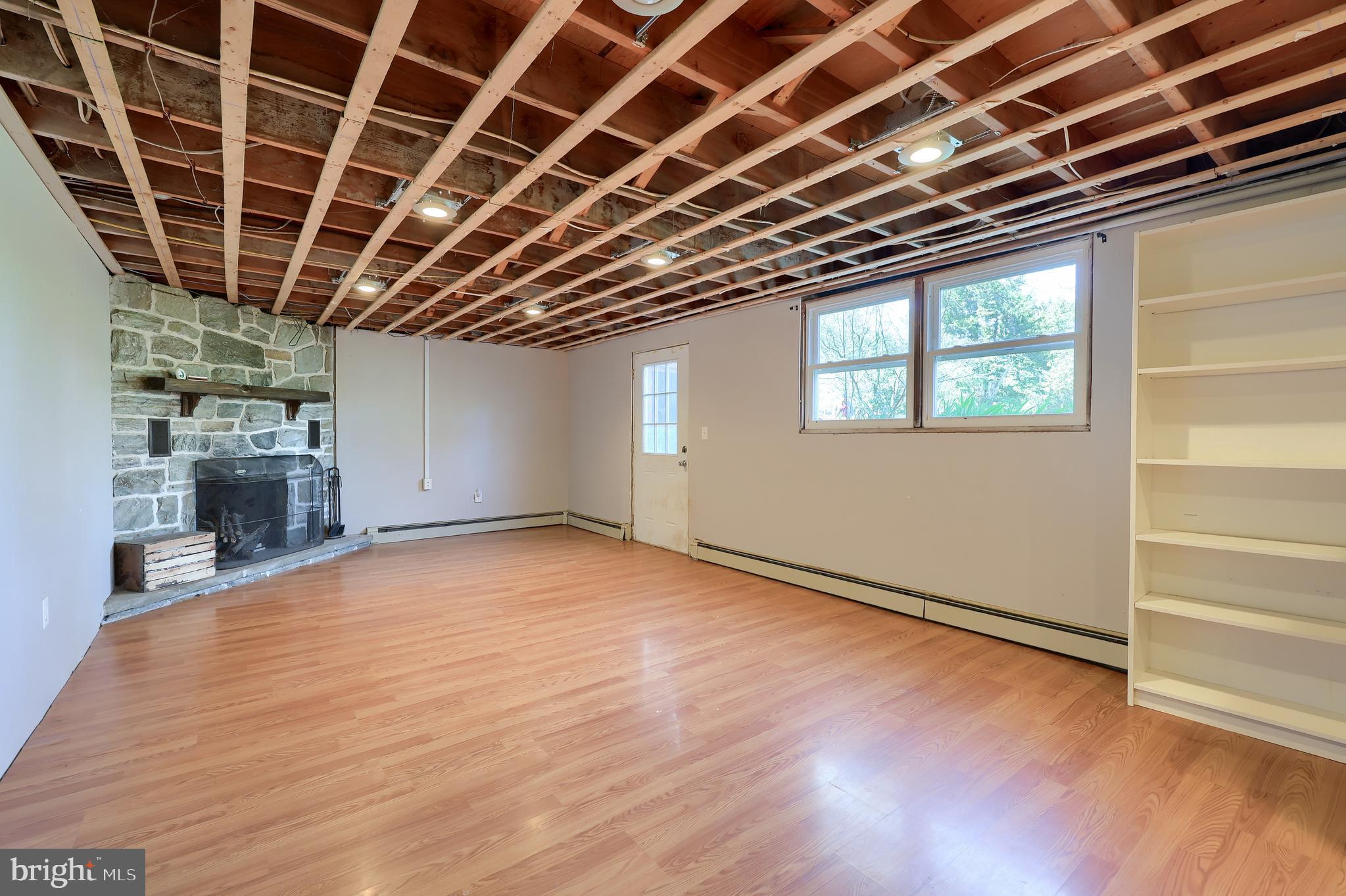 2033 Robindale Avenue Lancaster, PA 17601 - Photo 31 of 47 a view of an empty room with a window and wooden floor