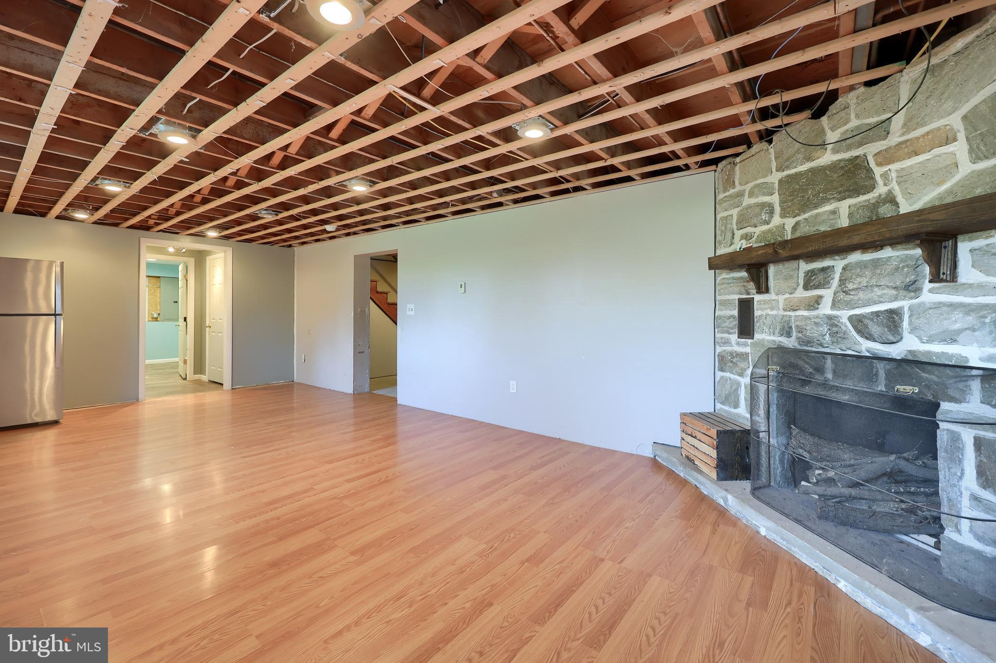 2033 Robindale Avenue Lancaster, PA 17601 - Photo 32 of 47 a view of an empty room with wooden floor and a window