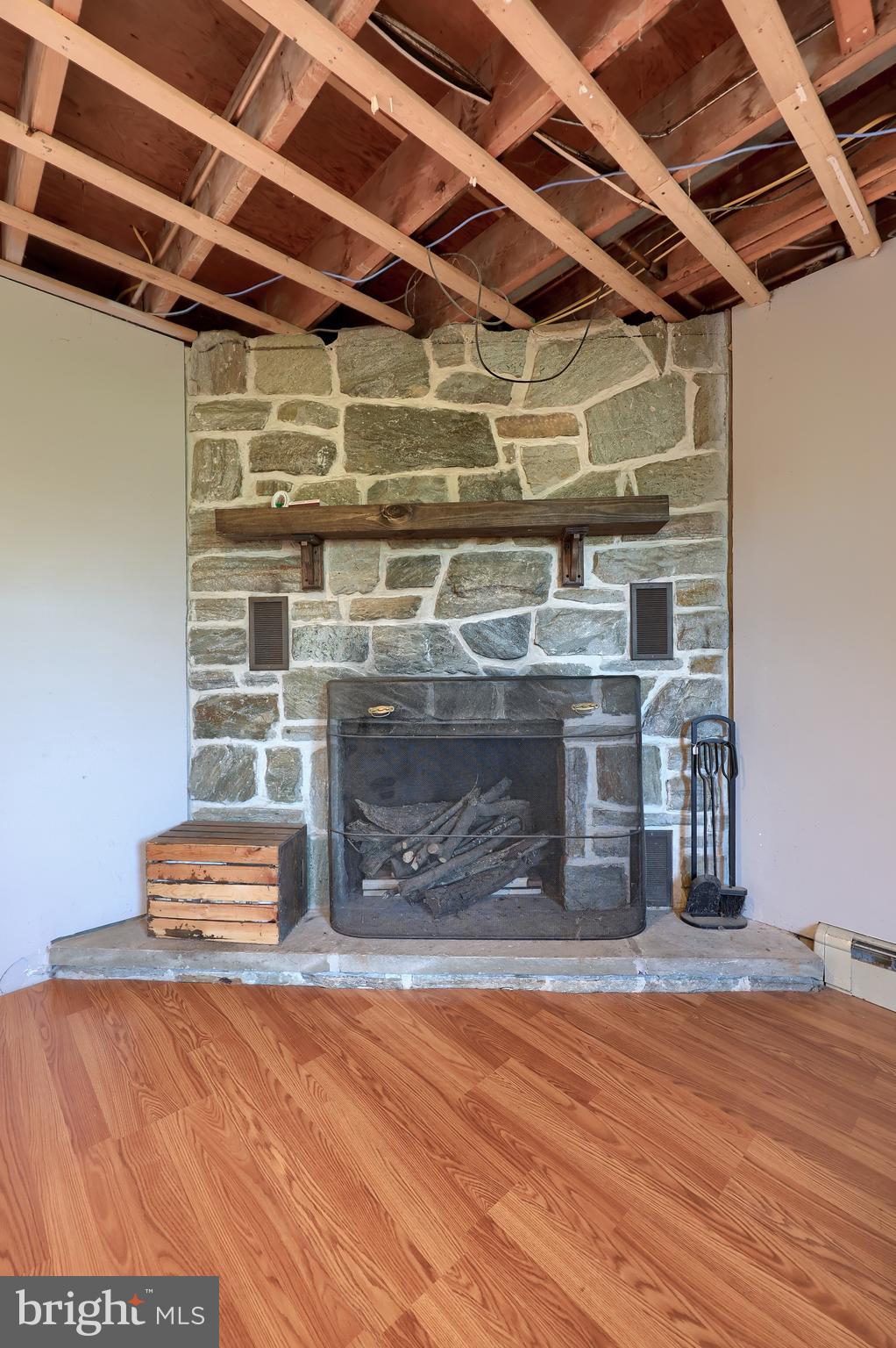 2033 Robindale Avenue Lancaster, PA 17601 - Photo 33 of 47 a view of empty room with wooden floor and fireplace