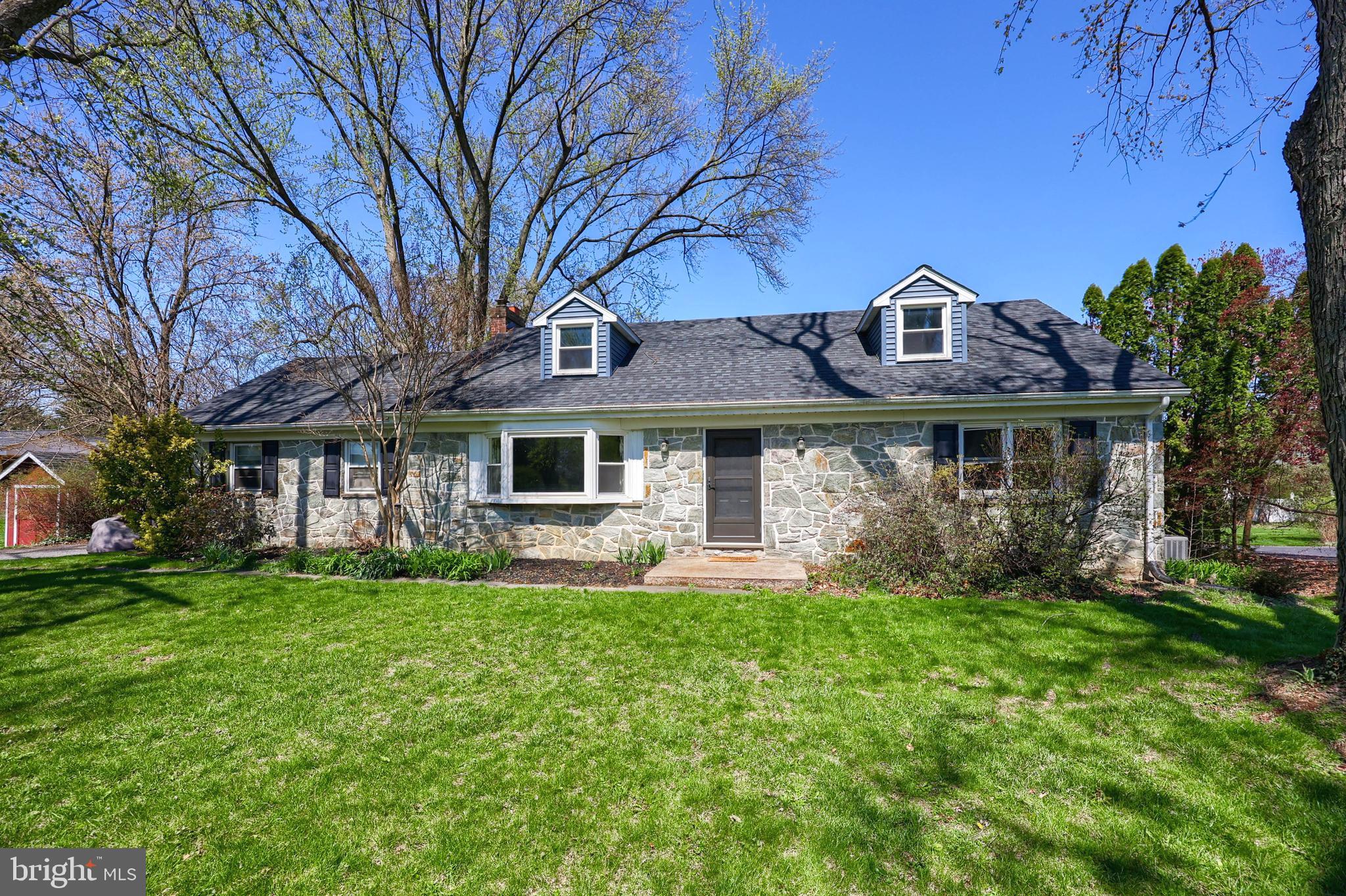 2033 Robindale Avenue Lancaster, PA 17601 - Photo 42 of 47 a front view of a house with a yard table and chairs