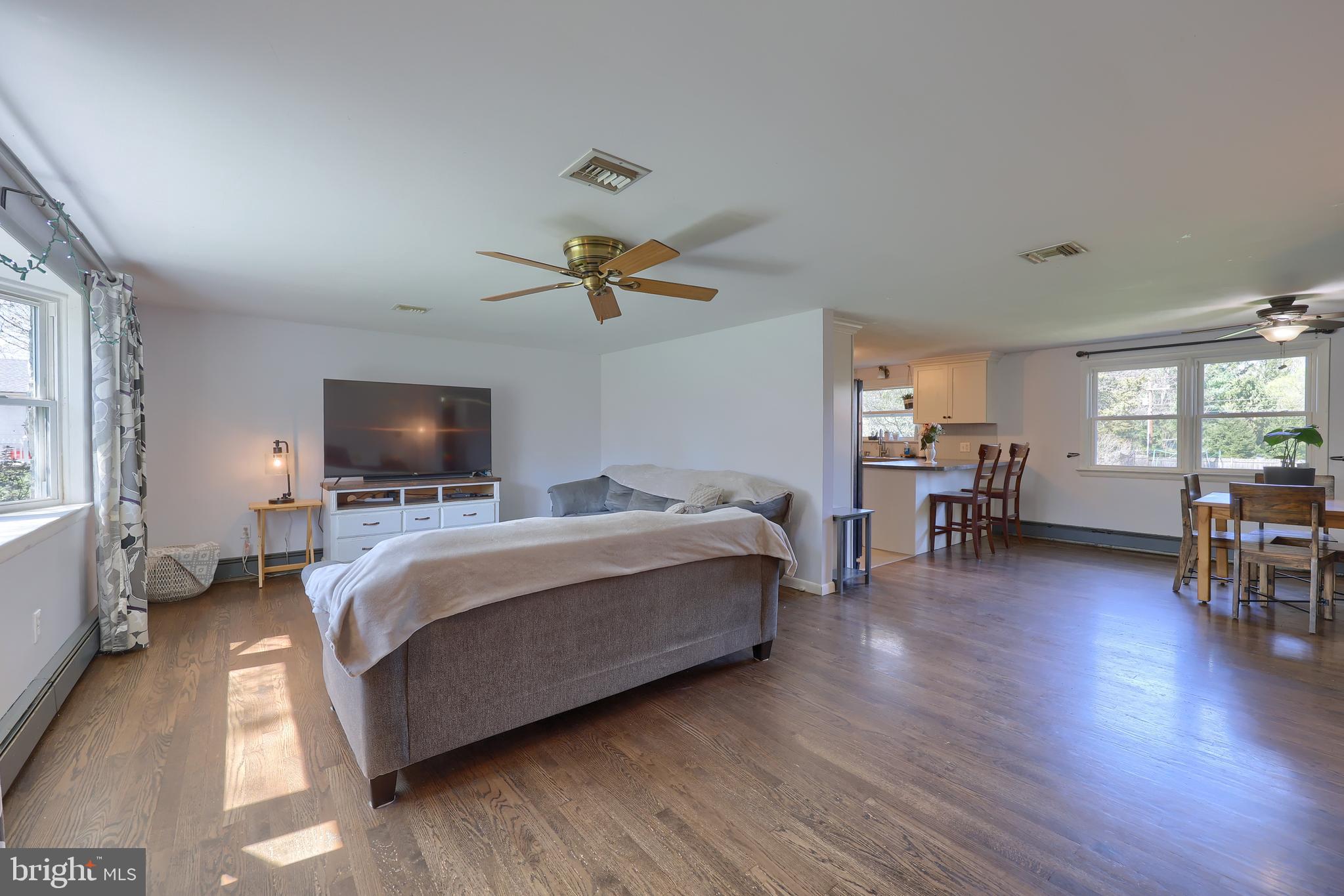 2033 Robindale Avenue Lancaster, PA 17601 - Photo 6 of 47 a living room with furniture flat screen tv and wooden floor