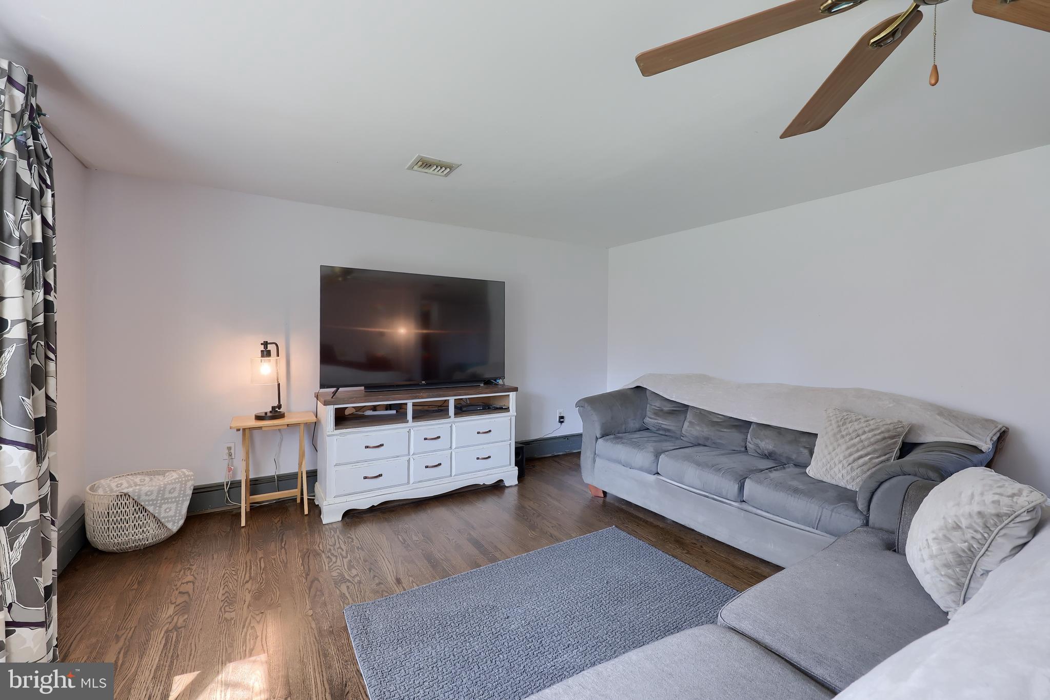 2033 Robindale Avenue Lancaster, PA 17601 - Photo 7 of 47 a living room with furniture and a flat screen tv