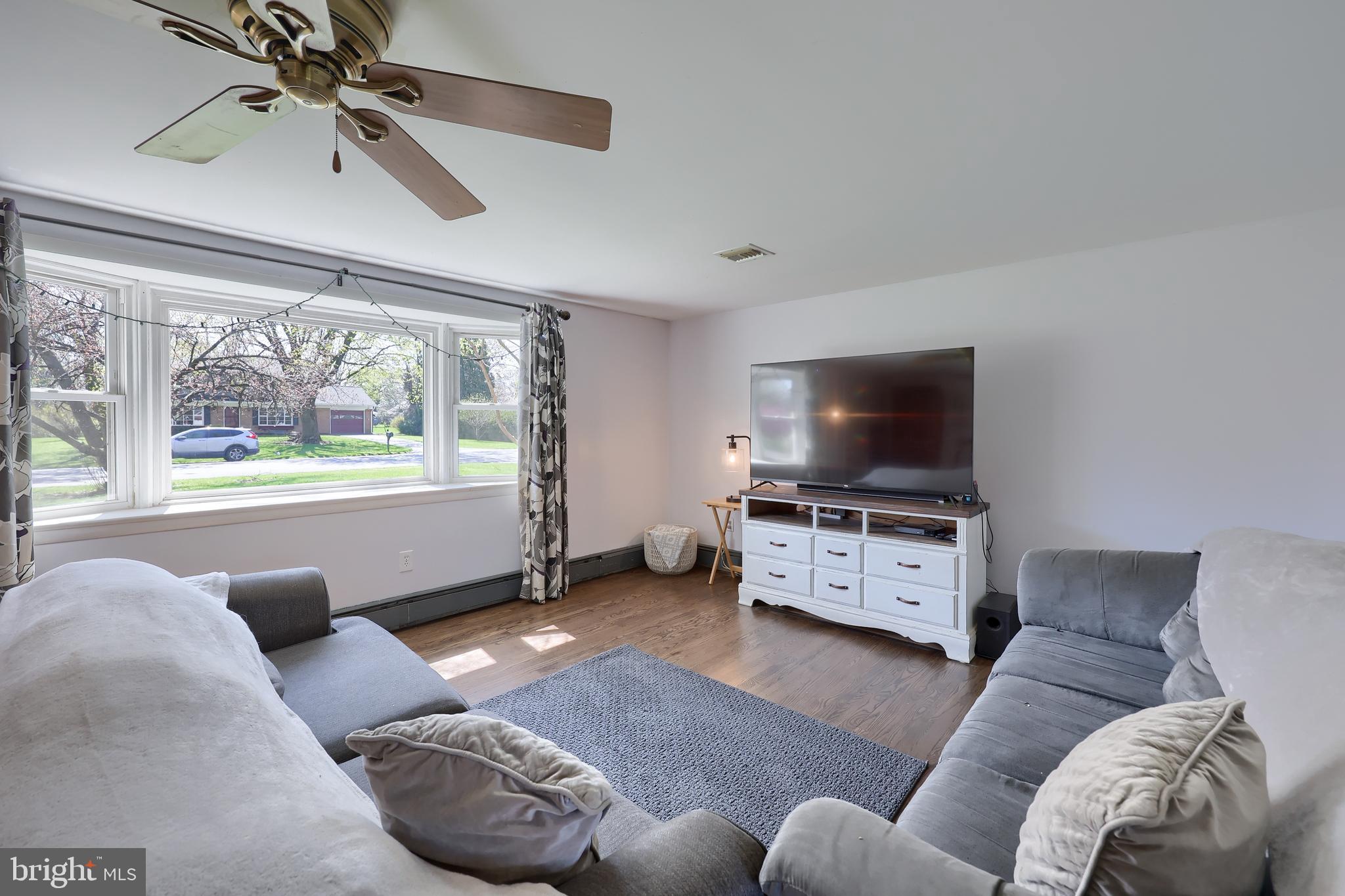 2033 Robindale Avenue Lancaster, PA 17601 - Photo 8 of 47 a living room with furniture and a flat screen tv